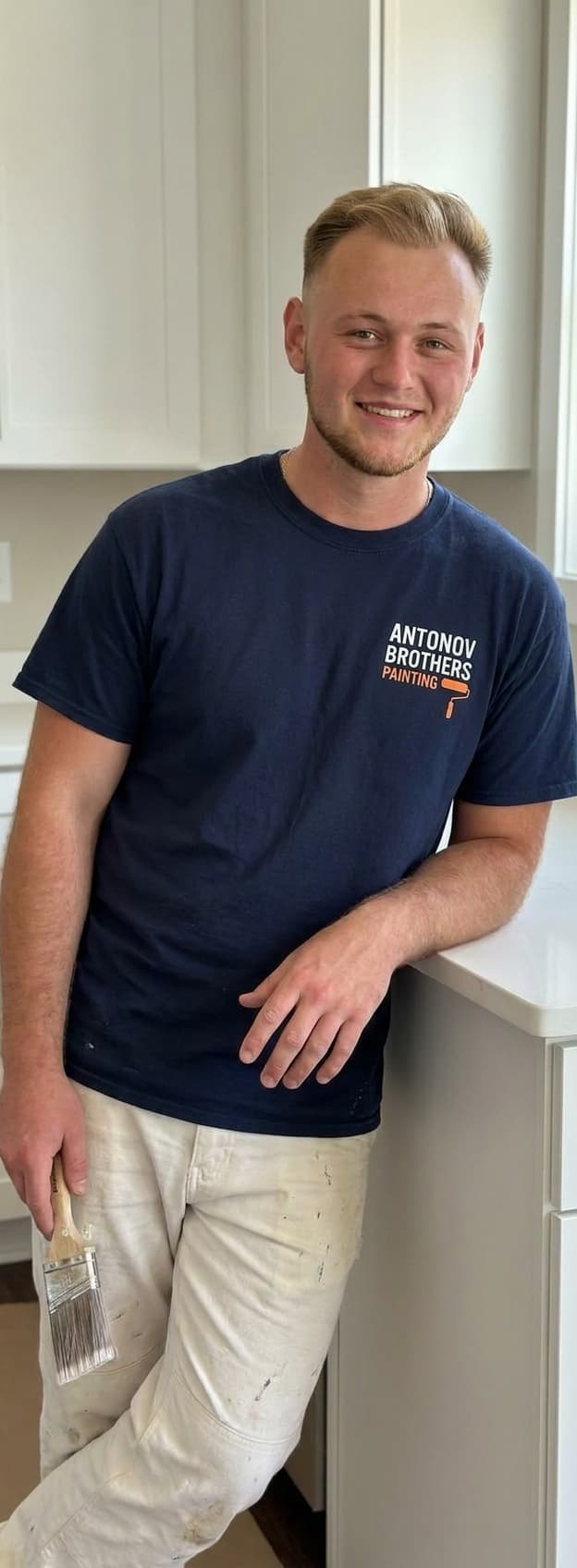 Antonov Brothers painter in a finished crisp-white kitchen in Jacksonville, FL