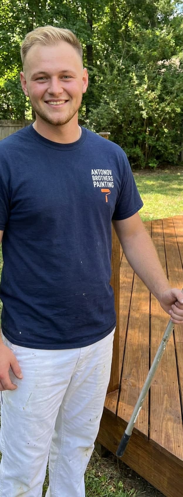 Antonov Brothers painter by a finished freshly stained deck in Jacksonville, FL