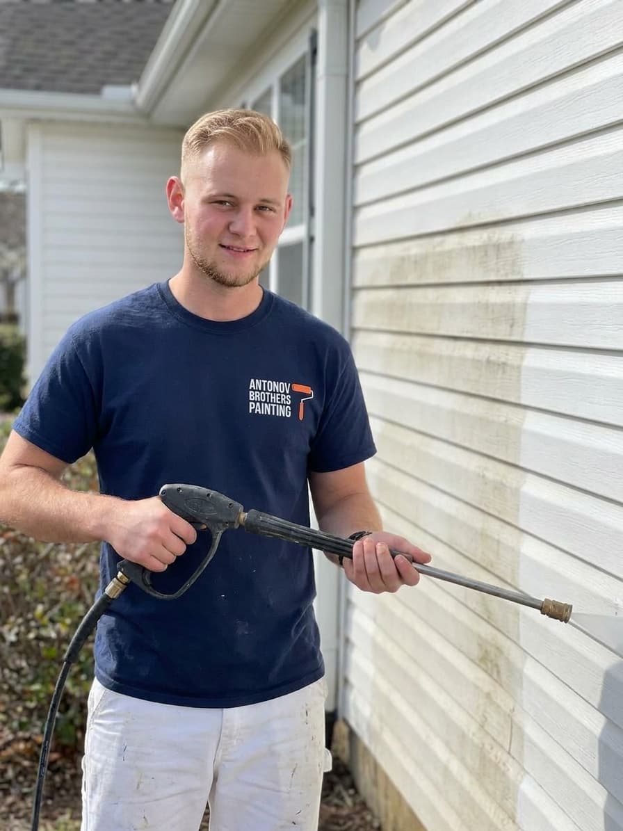 Antonov Brothers crew pressure washing house siding in Jacksonville, FL
